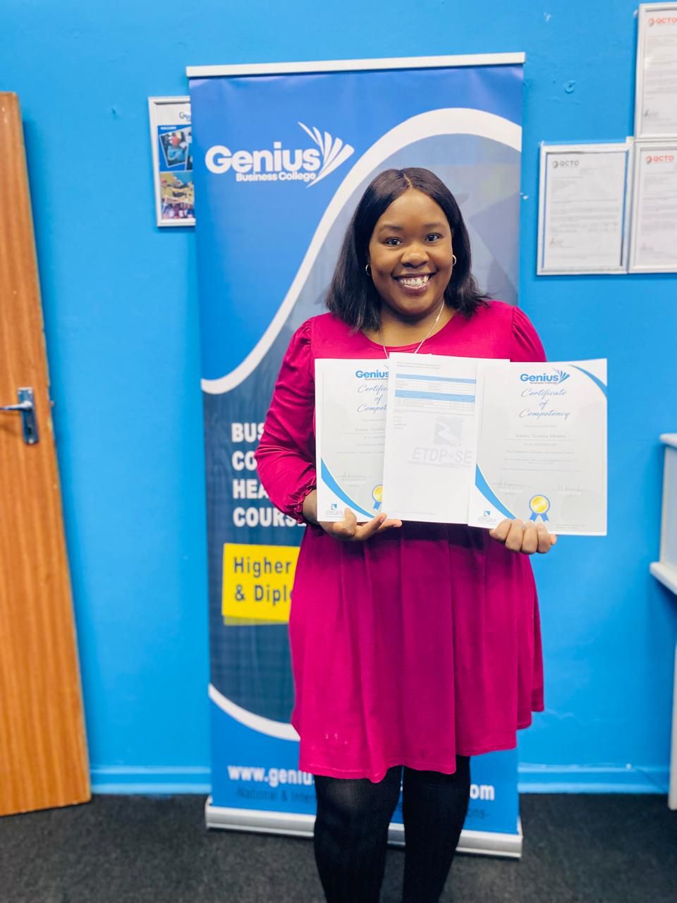 Learner holding a certificate